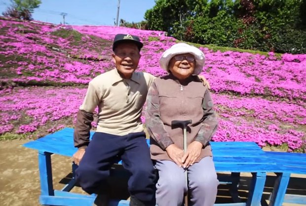 man planting flowers to blind wife 