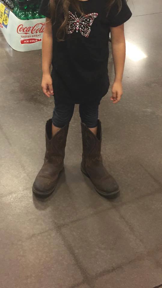 girl wearing daddys boots