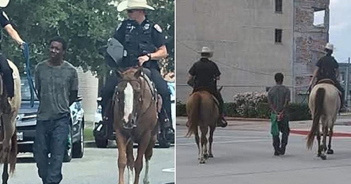 officers horseback lead handcuffed black man