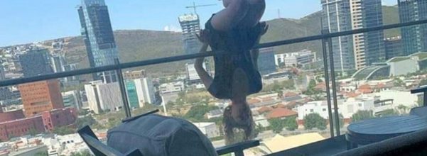 woman falls balcony yoga