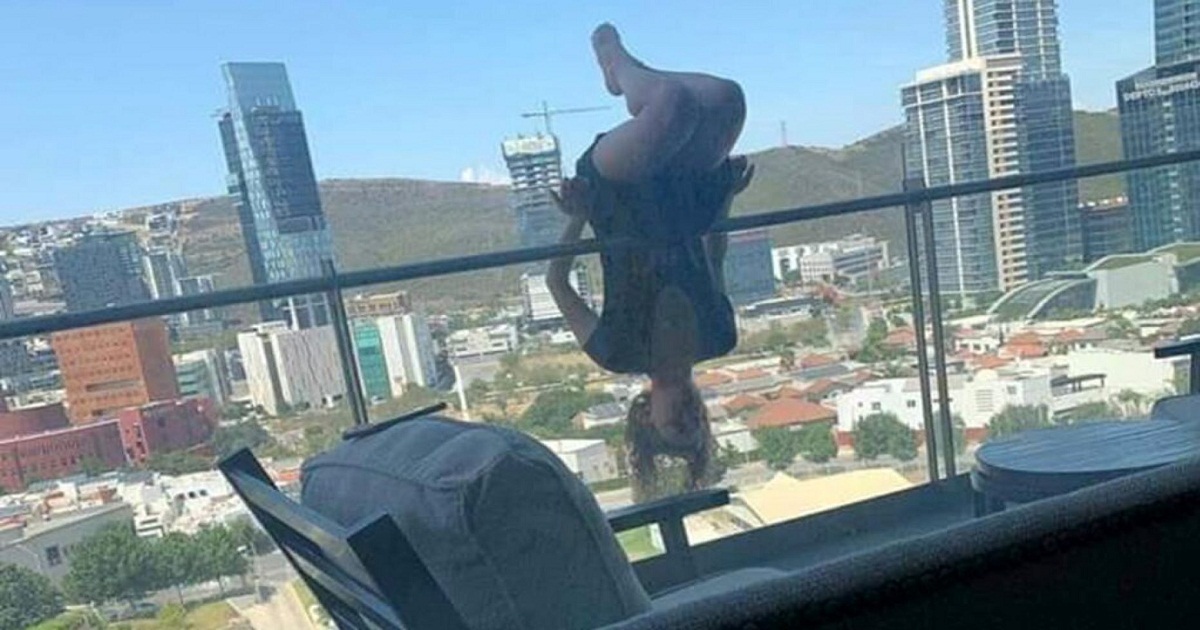 woman falls balcony yoga